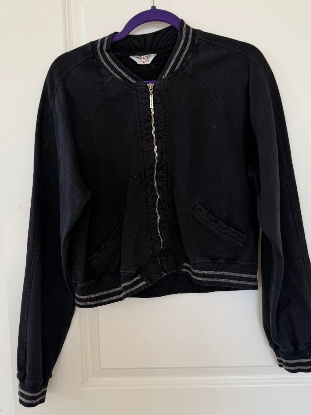 True Hard Tail classic, this fleece baseball jacket brings back the sporty look